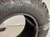 a close up of a tire on a white surface