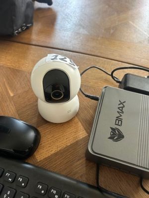an image of a camera and a keyboard on a desk