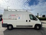 a white van that is parked in a parking lot