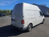 a white van that is parked in a parking lot