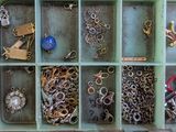 a box filled with lots of different types of jewelry