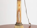 a lamp that is on a table with a lamp shade