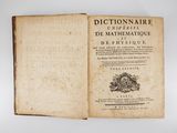 an old book with a black and white image on it