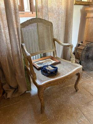 a chair that is sitting in front of a window