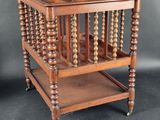 an old wooden table with a wooden shelf on top of it