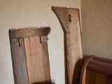 a chair that is sitting next to a wooden bench