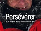 the cover of the book perseverer, with a man in a red jacket and a black hat