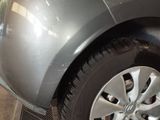 a close up of a car ' s tire on the ground
