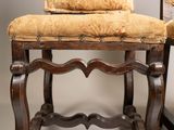 two chairs that are sitting next to each other