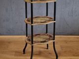 an image of a three tiered table on a wooden floor