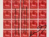 a red stamp with a picture of a man on it