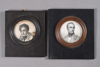 two framed portraits of two men, one of whom is a gentleman and the other of whom is a woman