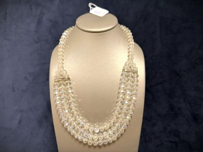 a close up of a necklace on a mannequin on a mannequin