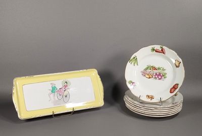 plusieurs assiettes et un plateau sur lesquels figure l'image d'une femme