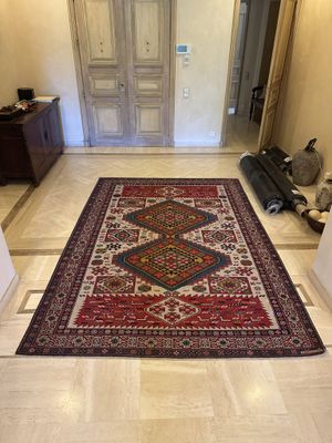 a rug on the floor in the hallway of a house