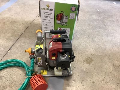 a box with a hose and a pump on the floor