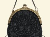black beaded purse with gold trim and fringes