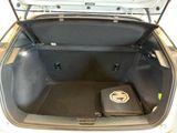 a trunk of a car with a laptop in it