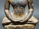 an image of a statue of a person sitting on a wooden base