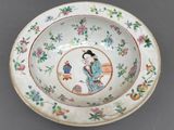an image of a bowl with a woman and a bird on it