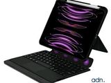 an image of a black laptop with a purple keyboard on top of it