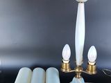 three lamps that are sitting on a table next to each other