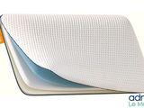 a close up of a pillow on a white surface