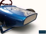 a blue toy car with a steering and a steering wheel