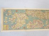 an old map of the world is hanging on a wall