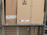 boxes are stacked on top of a metal cart in a warehouse