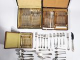 a lot of silverware in a box on a table