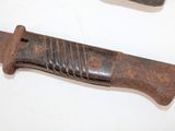 two knives that are sitting on a table