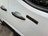 a close up of a car door handle with a sticker on it