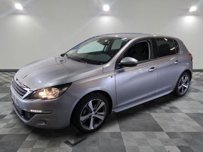 a picture of a silver car parked in a showroom
