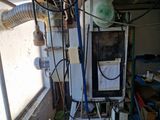 an image of a water heater that is in a garage