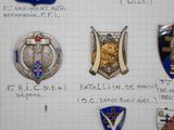 many different types of badges displayed on a piece of paper
