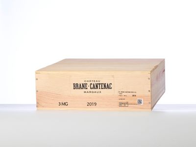a wooden box with a label on it sitting on a table
