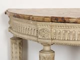 a table with a marble top and a wooden base