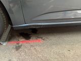 a close up of a car ' s tire with a hole in it