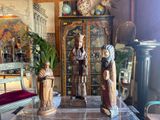 three statues on a table in a living room