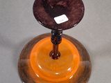 two glass candlesticks sitting on top of a table