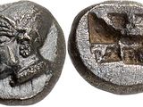 a silver coin with an image of a man on it