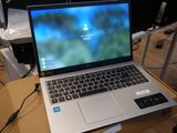 a laptop computer sitting on top of a box on a table