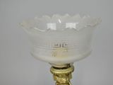 an image of a white glass bowl on a gold metal stand