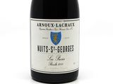 a bottle of wine that is sitting on a table