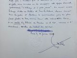 an old letter written in french on a piece of paper with a blue marker