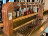 a bar with a lot of bottles on the counter