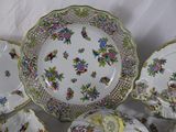 many plates and bowls that are sitting on a table