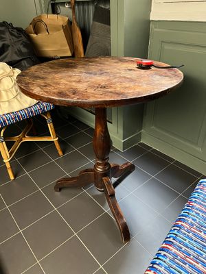 a small table that is in the corner of a room