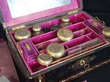 a pink box that has a bunch of different items inside of it